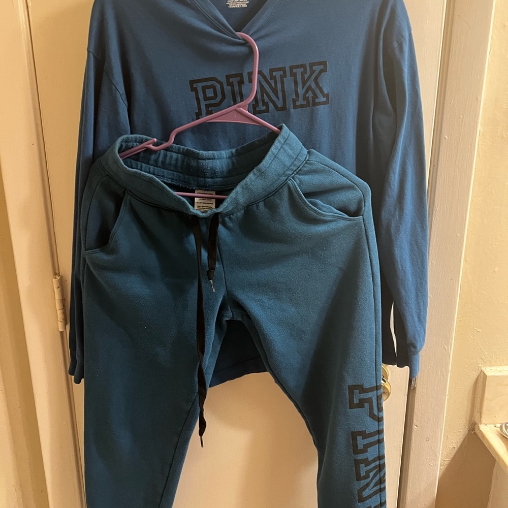 Pink Victoria Secret set. The shirt is a T-Shirt and the bottom are joggers.